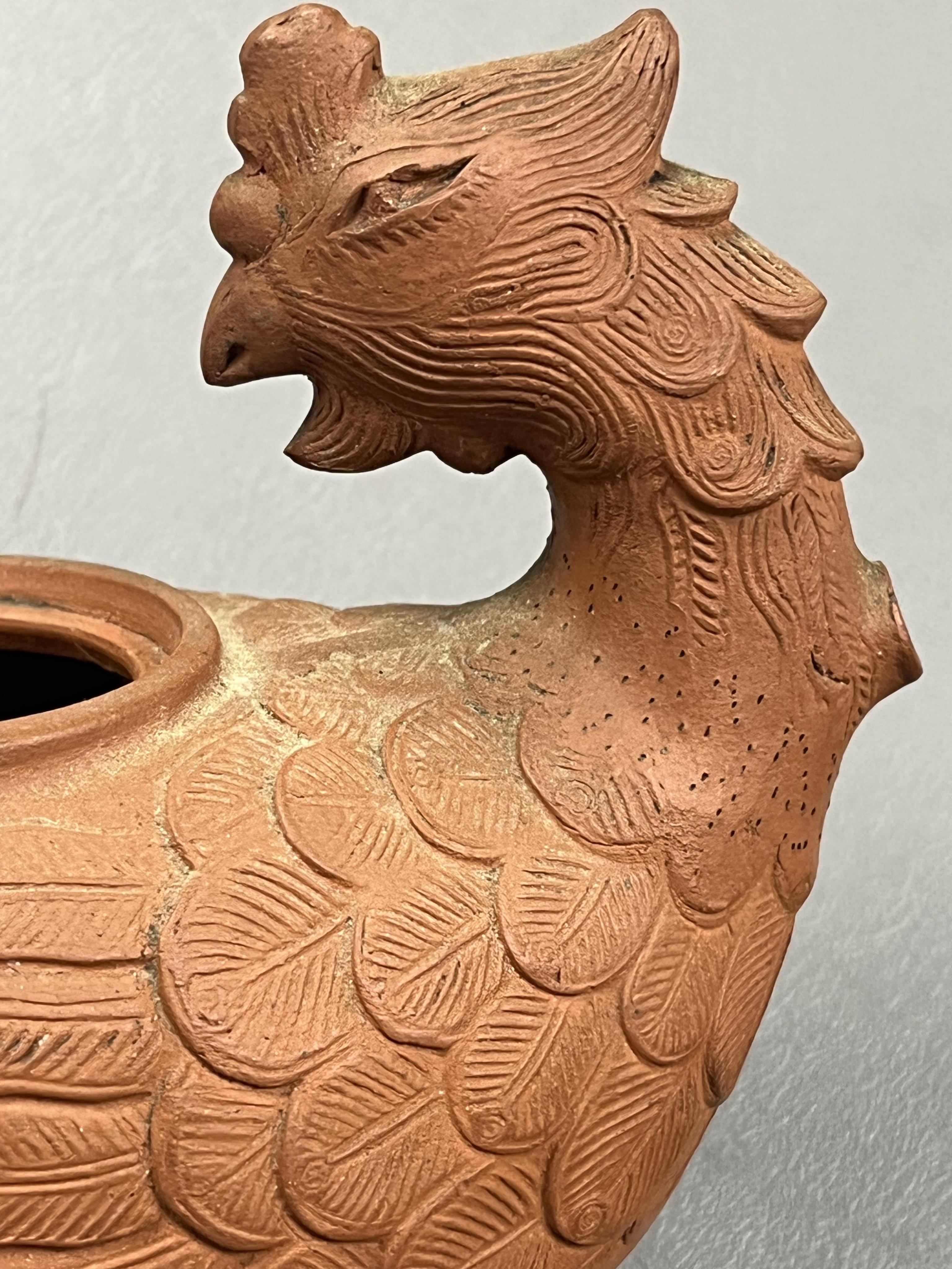 A Chinese Yixing 'Phoenix' teapot, late Qing dynasty
